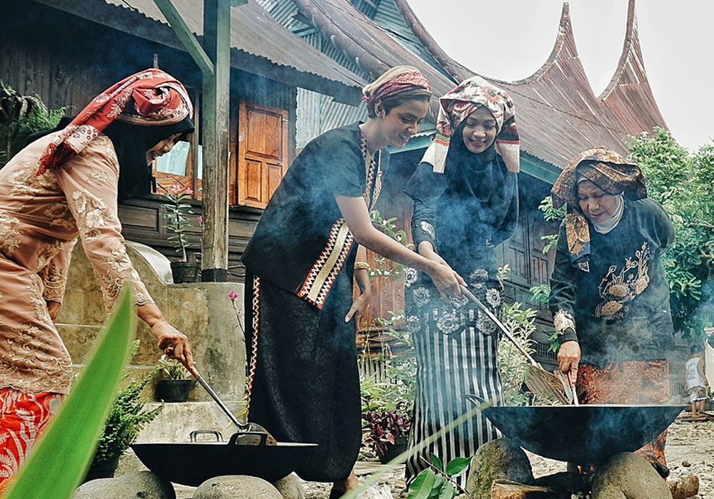 Minangkabau woman cooking rendang  