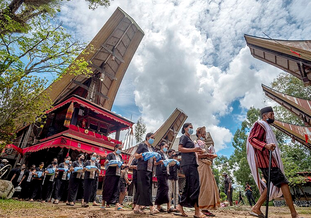 Welcoming guest at a rambu solo event Toraja